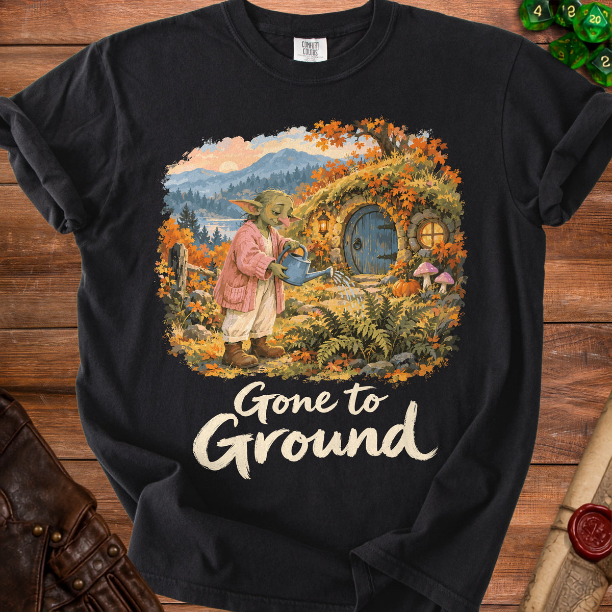 Goblin watering a hobbit hole in autumn with "Gone to Ground" text.