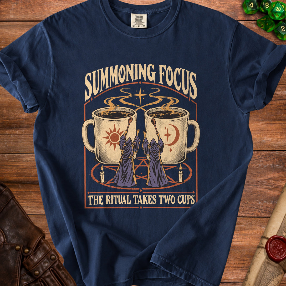 Navy t-shirt with "Summoning Focus The Ritual Takes Two Cups" text and mystical coffee cups graphic.