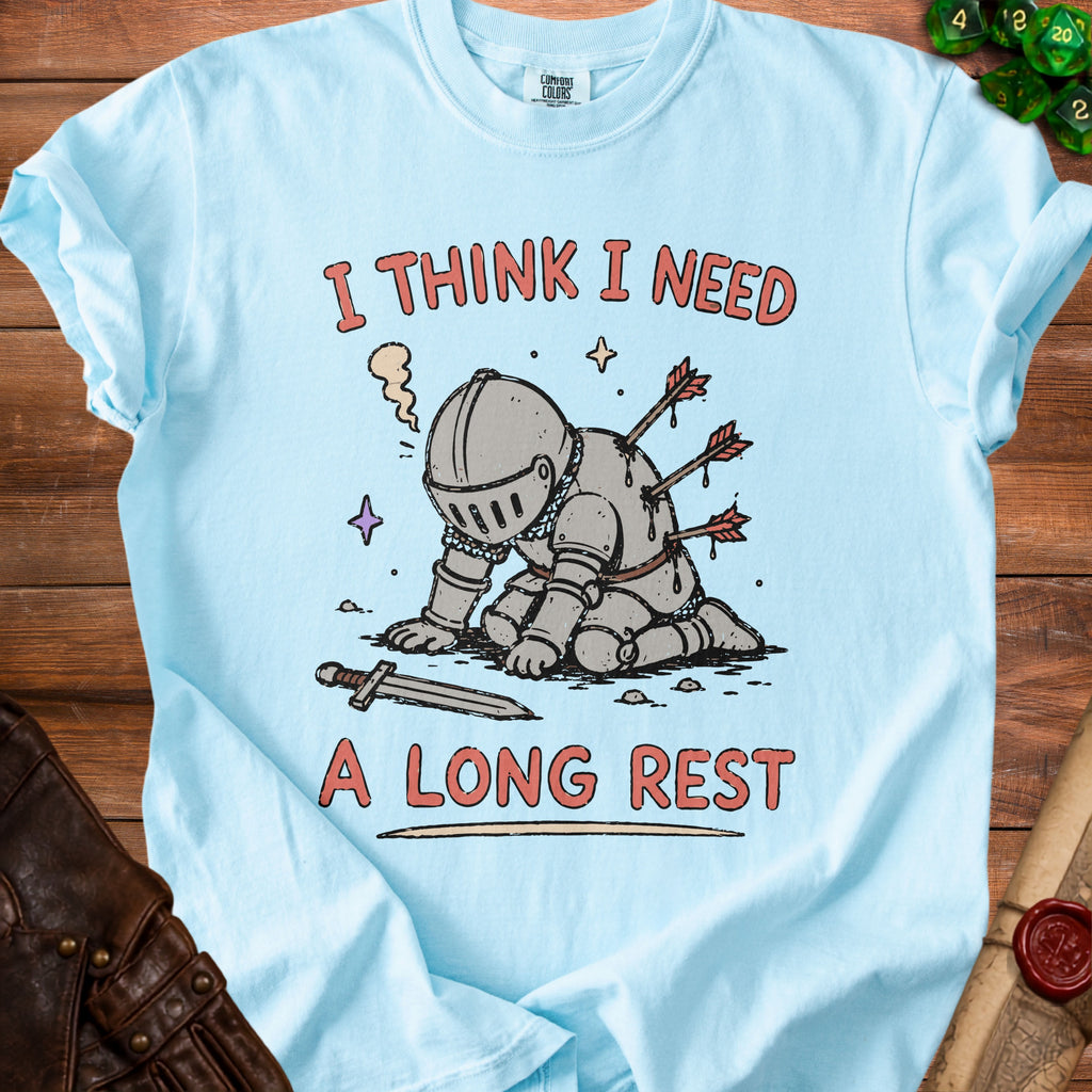 Light blue t-shirt with knight graphic and text "I THINK I NEED A LONG REST".