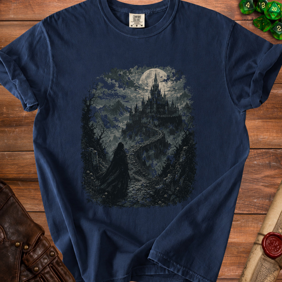 Dark blue t-shirt with a gothic castle and cloaked figure under a full moon.