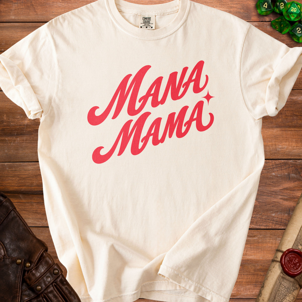 Cream t-shirt with red "Mana Mama" text and a star detail.