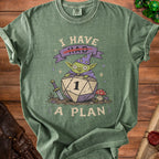 Green t-shirt with goblin on D20 die saying "I have a plan."