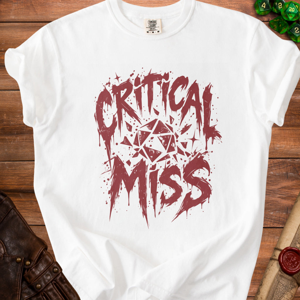 White t-shirt with "Critical Miss" text and a geometric dice graphic.