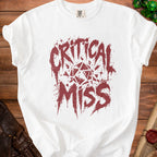 White t-shirt with "Critical Miss" text and a geometric dice graphic.
