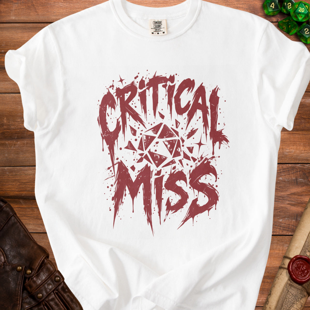 White t-shirt with "Critical Miss" text and a geometric dice graphic.