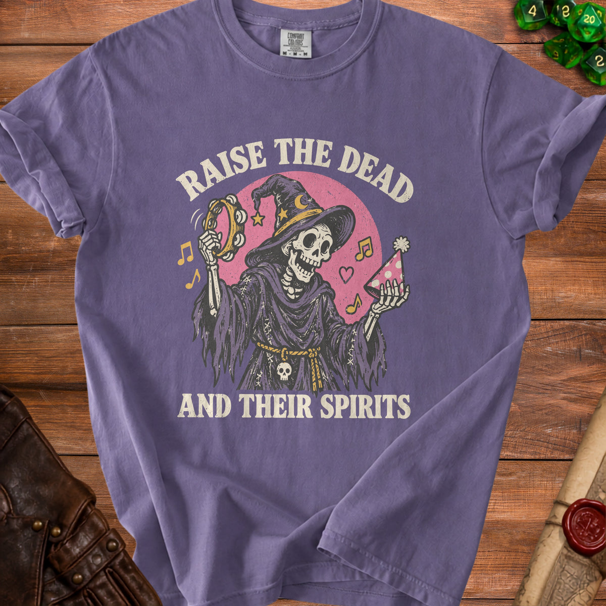 Skeleton in witch hat playing tambourine and holding party hat with text "Raise the Dead and Their Spirits".