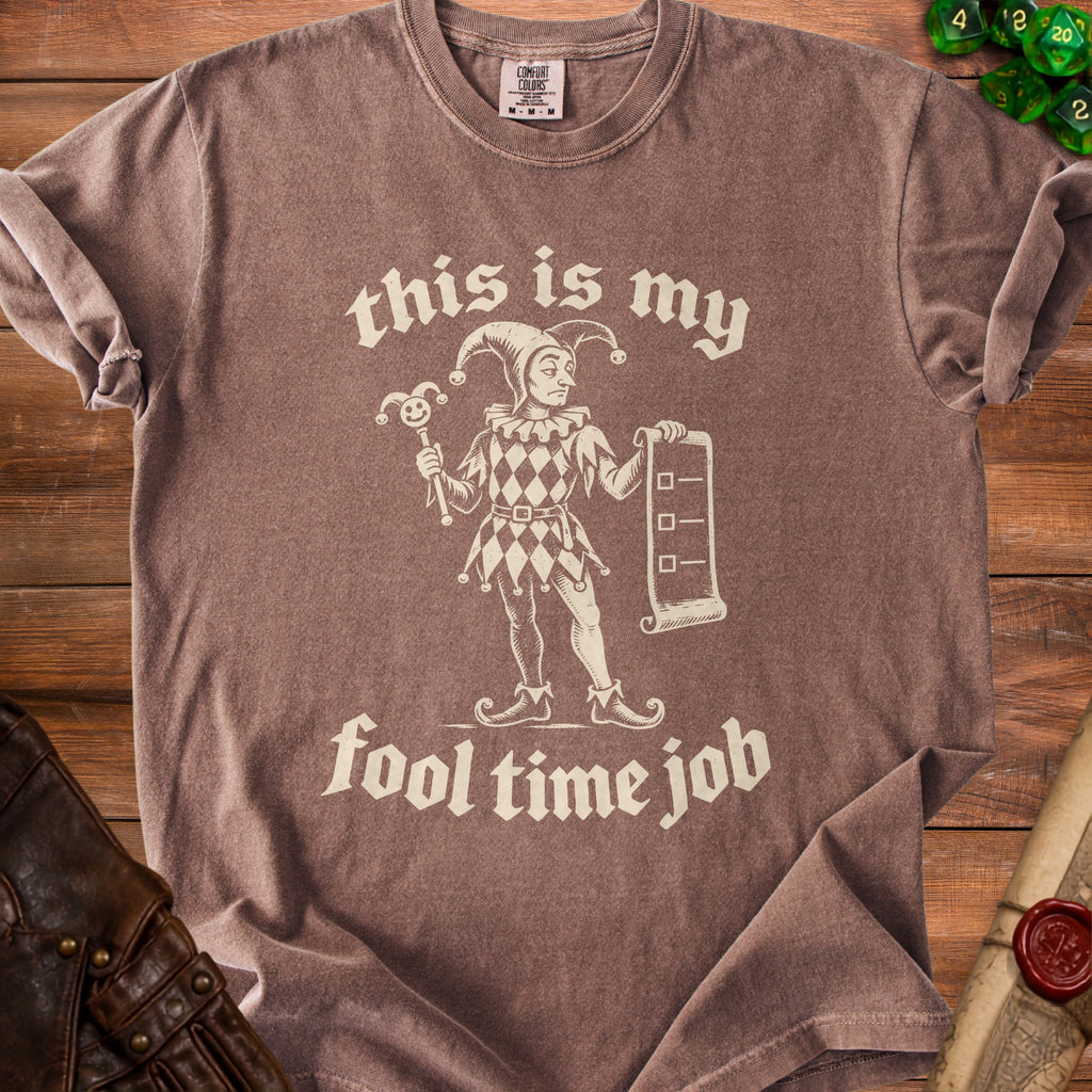 Brown t-shirt with a jester graphic and "this is my fool time job" text.
