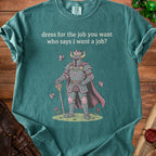 Green t-shirt with knight graphic and text "dress for the job you want who says i want a job?".