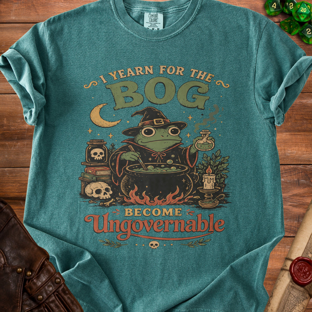 Teal t-shirt with frog wizard graphic and text "I YEARN FOR THE BOG BECOME Ungovernable".