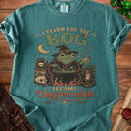 Teal t-shirt with frog wizard graphic and text "I YEARN FOR THE BOG BECOME Ungovernable".