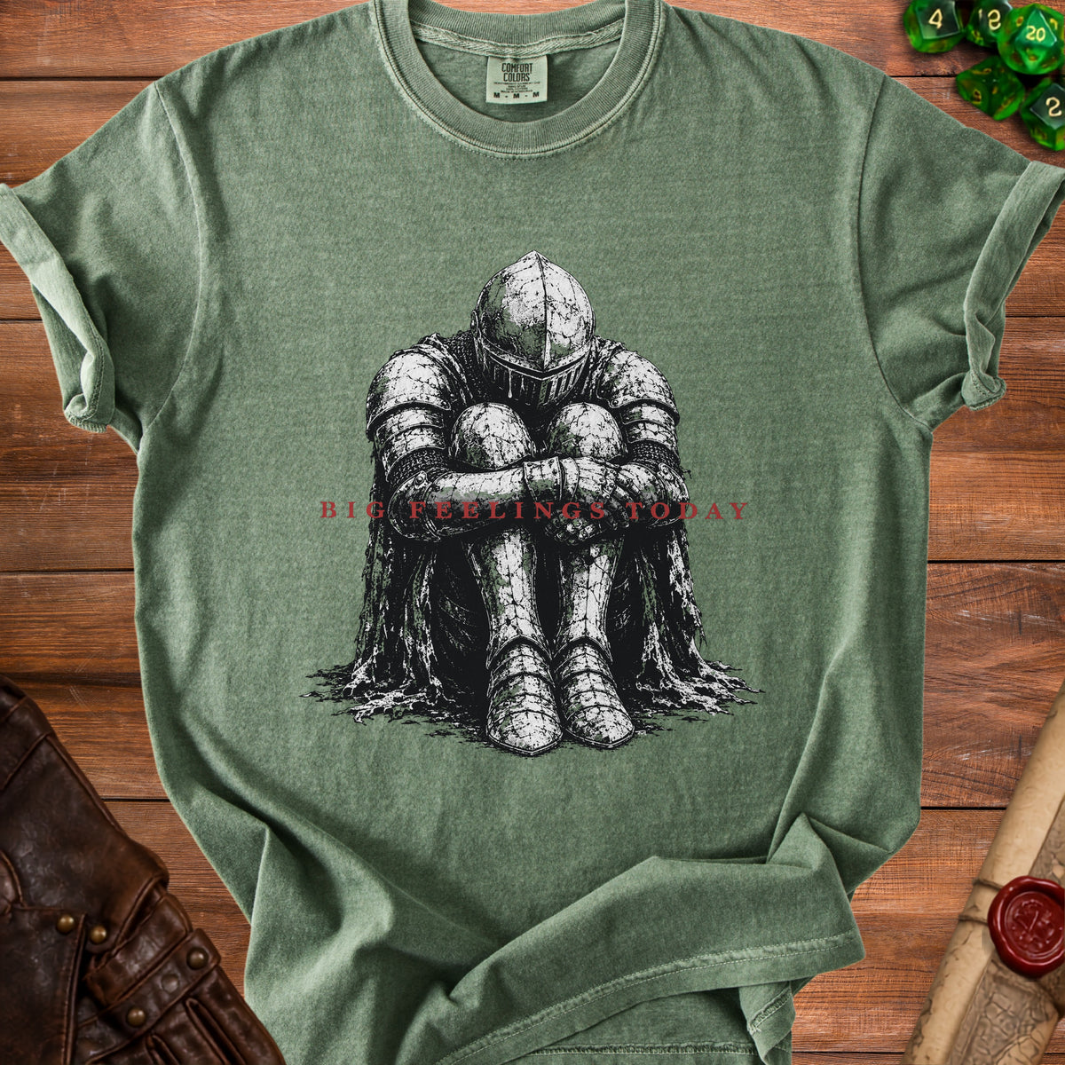 Green t-shirt with black ink drawing of knight sitting with head down, text reads "BIG FEELINGS TODAY".