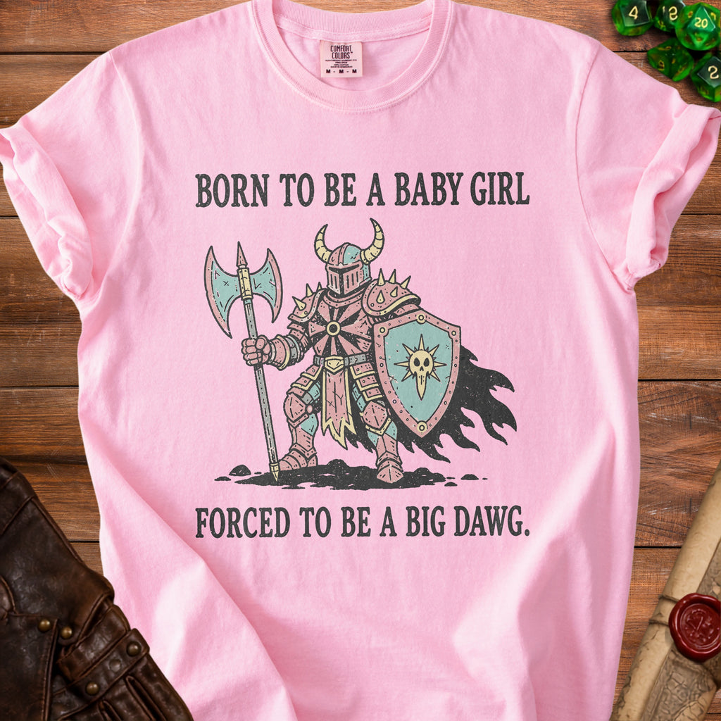 Pink t-shirt with knight graphic and text "Born to be a baby girl forced to be a big dawg."