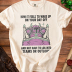 Cream t-shirt with a knight in armor sleeping in a bed and text.