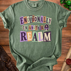 Green t-shirt with "Emotionally In Another Realm" text and desert landscape graphic.