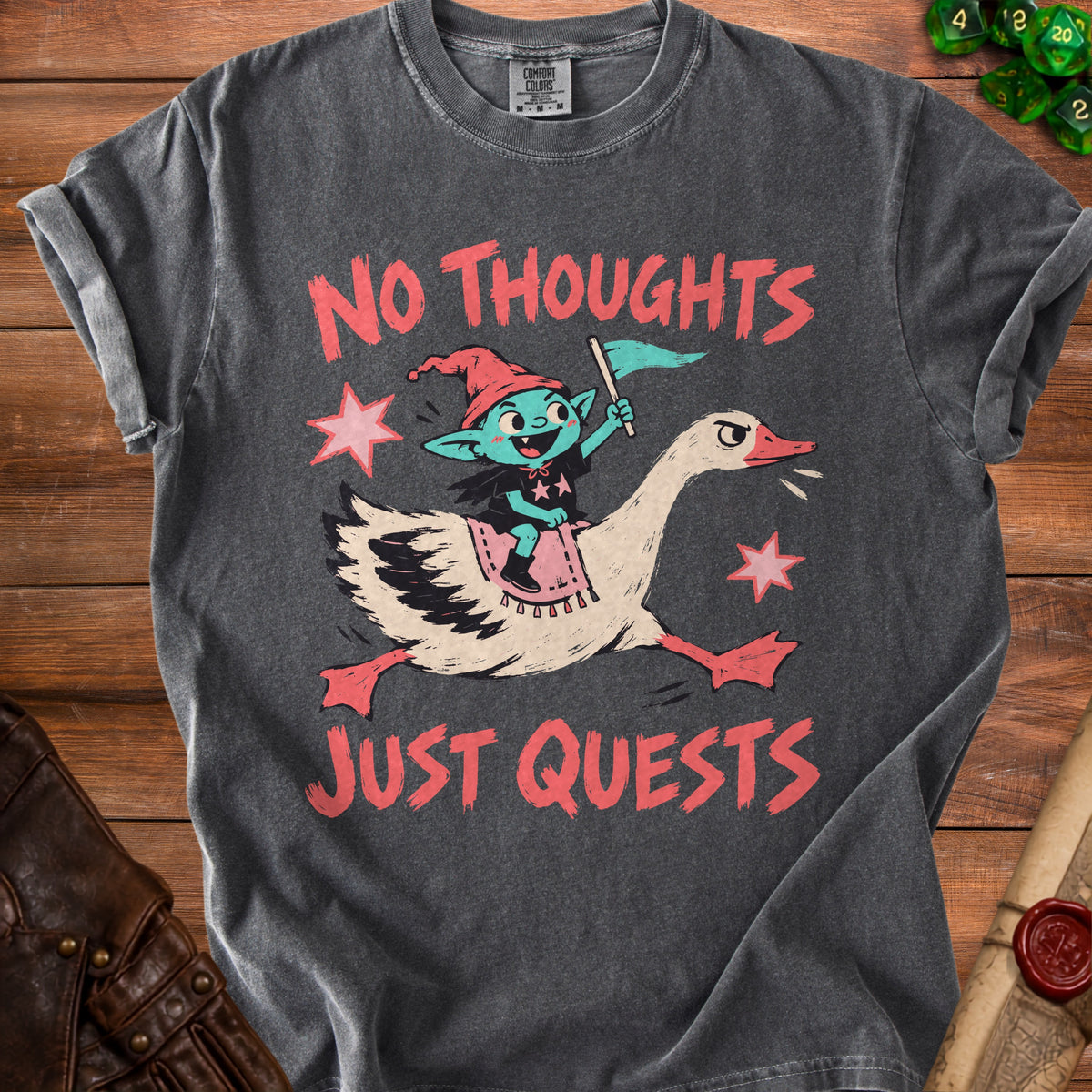 T-shirt with a graphic of a goblin riding a goose with text "No Thoughts Just Quests".