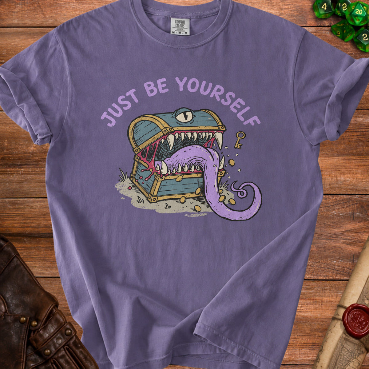 Purple t-shirt with a monster chest graphic and the text "JUST BE YOURSELF".