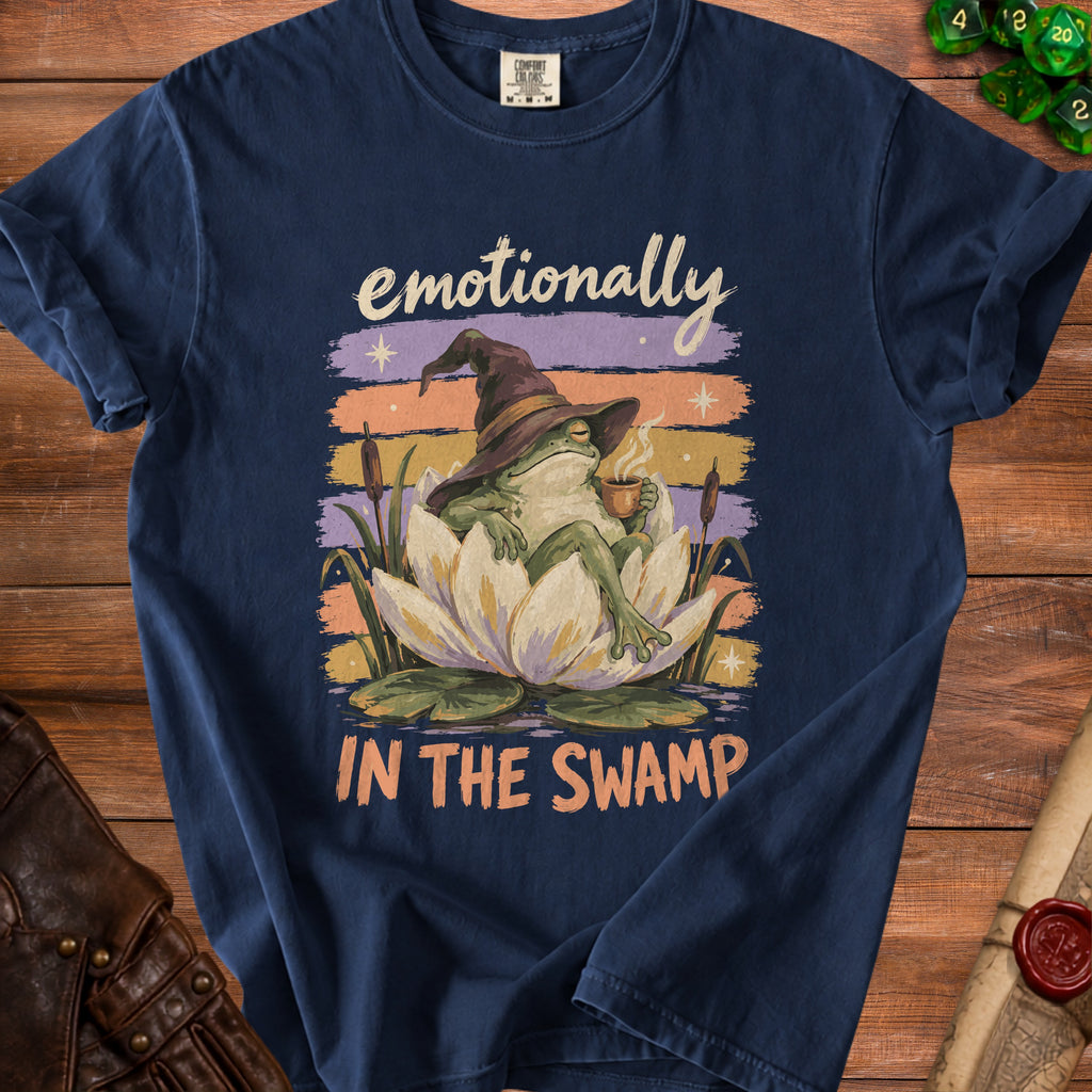 Frog wearing wizard hat drinks coffee on lotus, text "emotionally IN THE SWAMP".