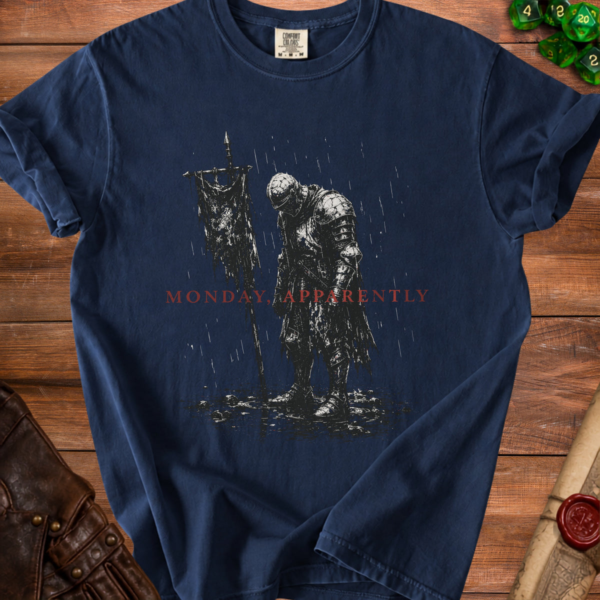 Dark blue t-shirt with knight holding a tattered banner, "MONDAY APPARENTLY" text.