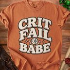 T-shirt with "CRIT FAIL BABE" text and a d20 die graphic.