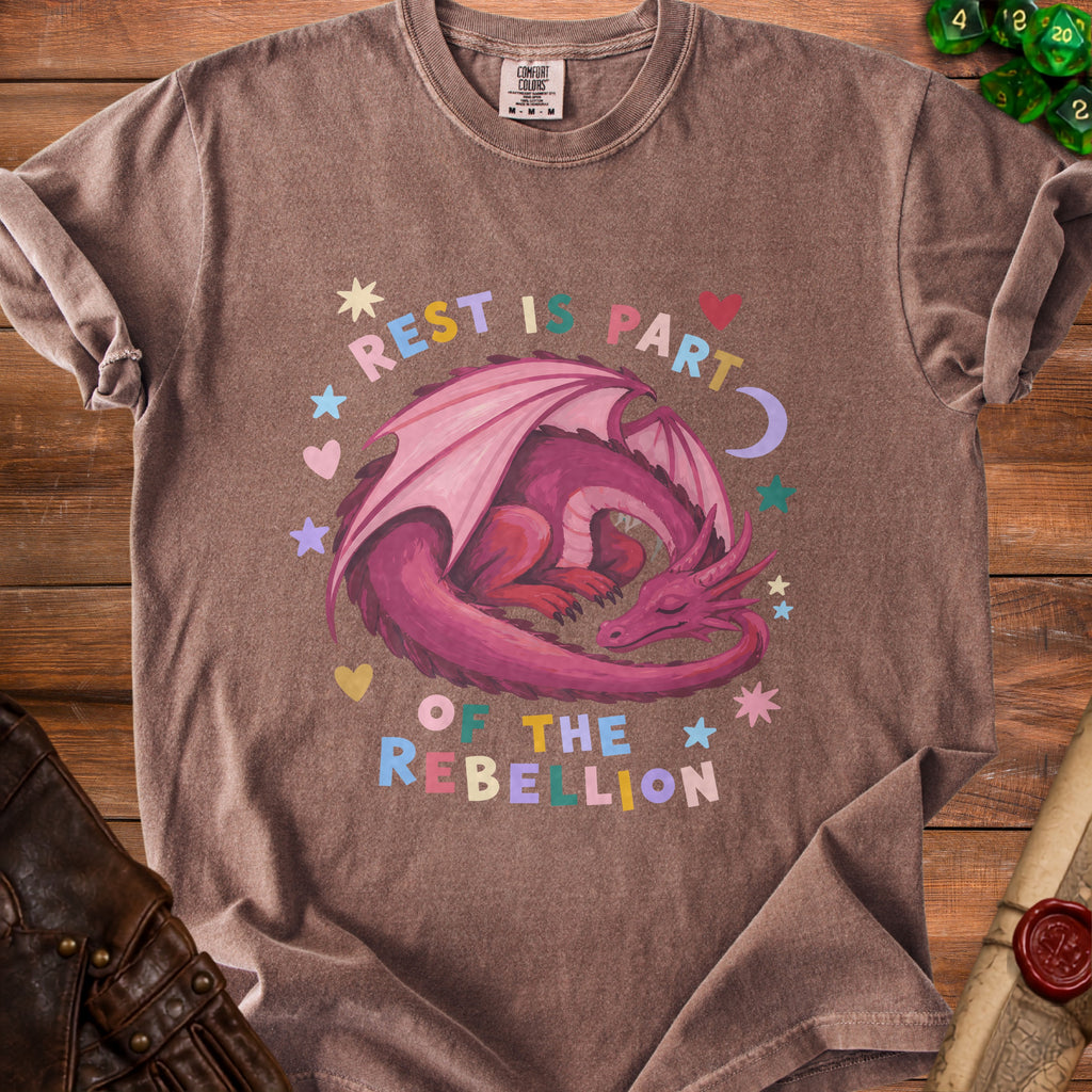 Brown t-shirt with pink dragon graphic and text "Rest is Part of The Rebellion".