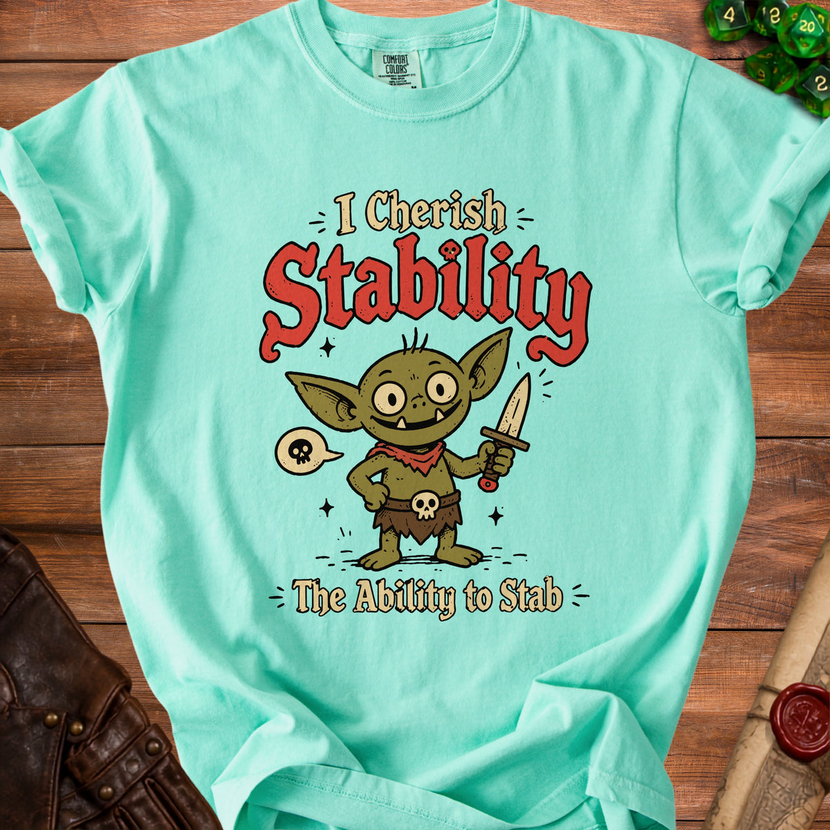Mint t-shirt with a cartoon goblin and text: "I Cherish Stability - The Ability to Stab".