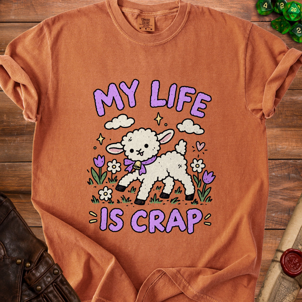 Orange t-shirt with a cartoon lamb and purple text that reads "MY LIFE IS CRAP".
