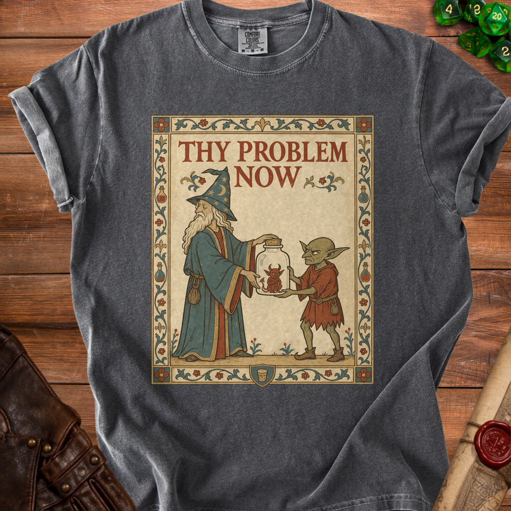 T-shirt with wizard holding jar with angry demon, goblin receiving it, and text "THY PROBLEM NOW".