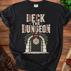 Black t-shirt with "Deck the Dungeon" text and a dungeon entrance with holly and a d20.