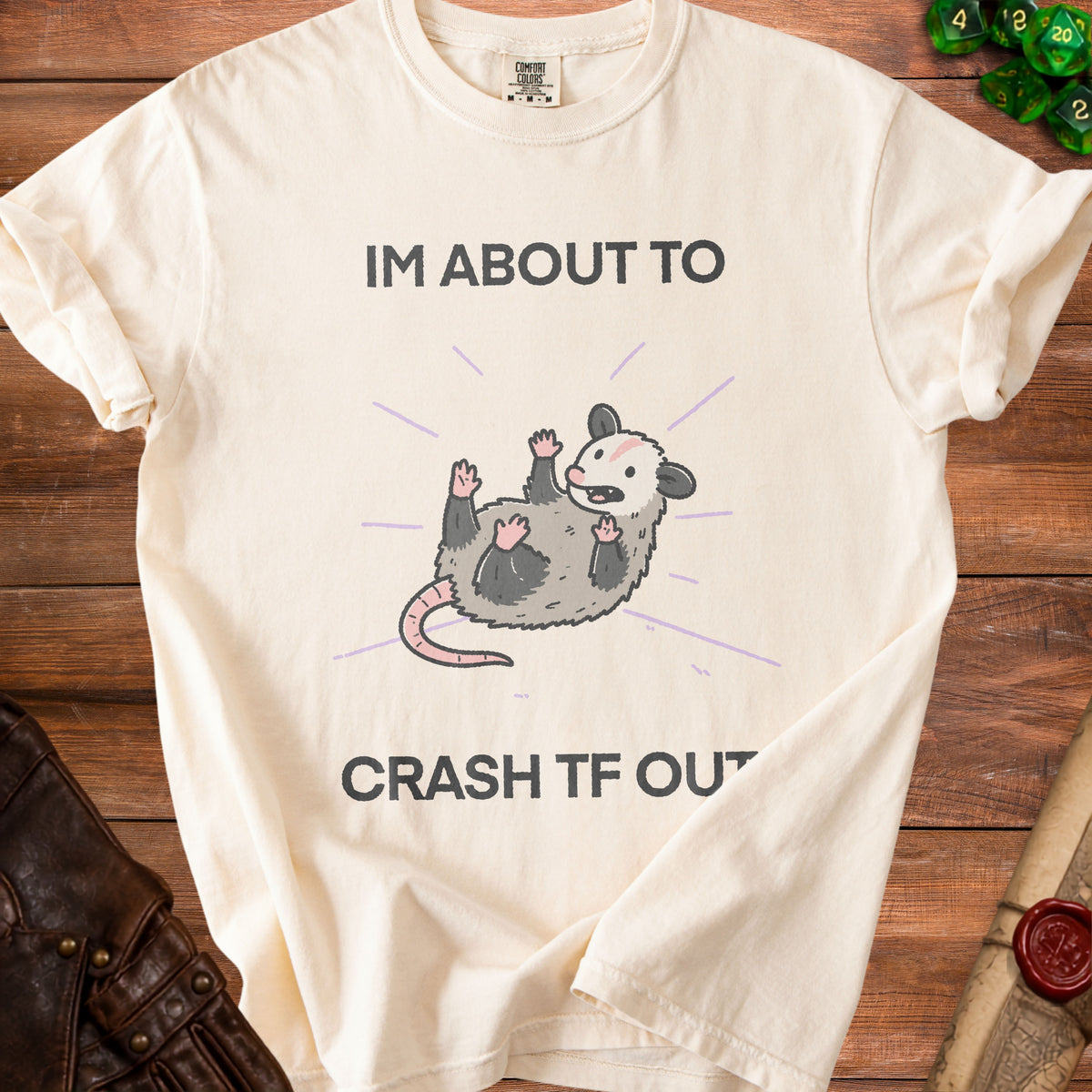 Cream t-shirt with opossum graphic and text "IM ABOUT TO CRASH TF OUT".