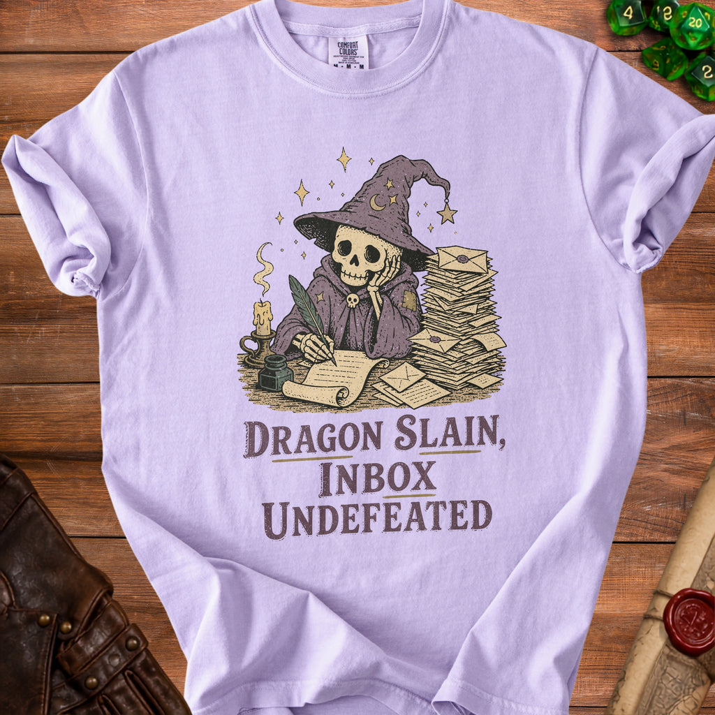 Skeleton in wizard hat writing at desk with stack of letters; text "Dragon Slain, Inbox Undefeated".