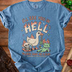 Blue t-shirt with graphic of duck, skeleton, and cat saying "I'll see you in hell please save me a seat".