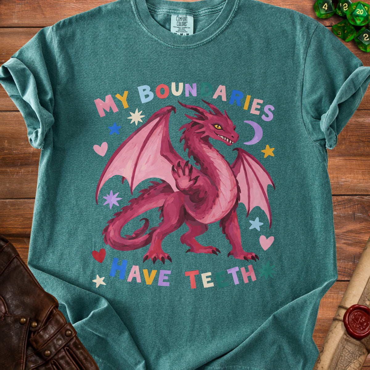 Teal t-shirt with pink dragon graphic and text "My Boundaries Have Teeth".