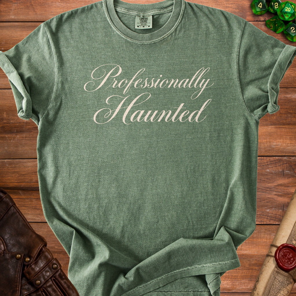 Green t-shirt with "Professionally Haunted" text in script font.