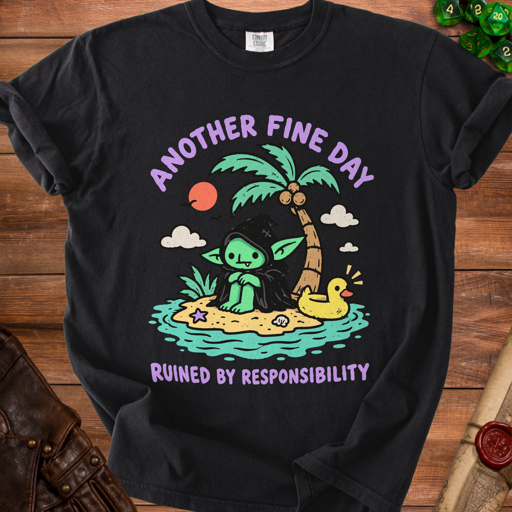 Black t-shirt with green goblin on island, palm tree, rubber duck, and text "Another Fine Day Ruined by Responsibility".