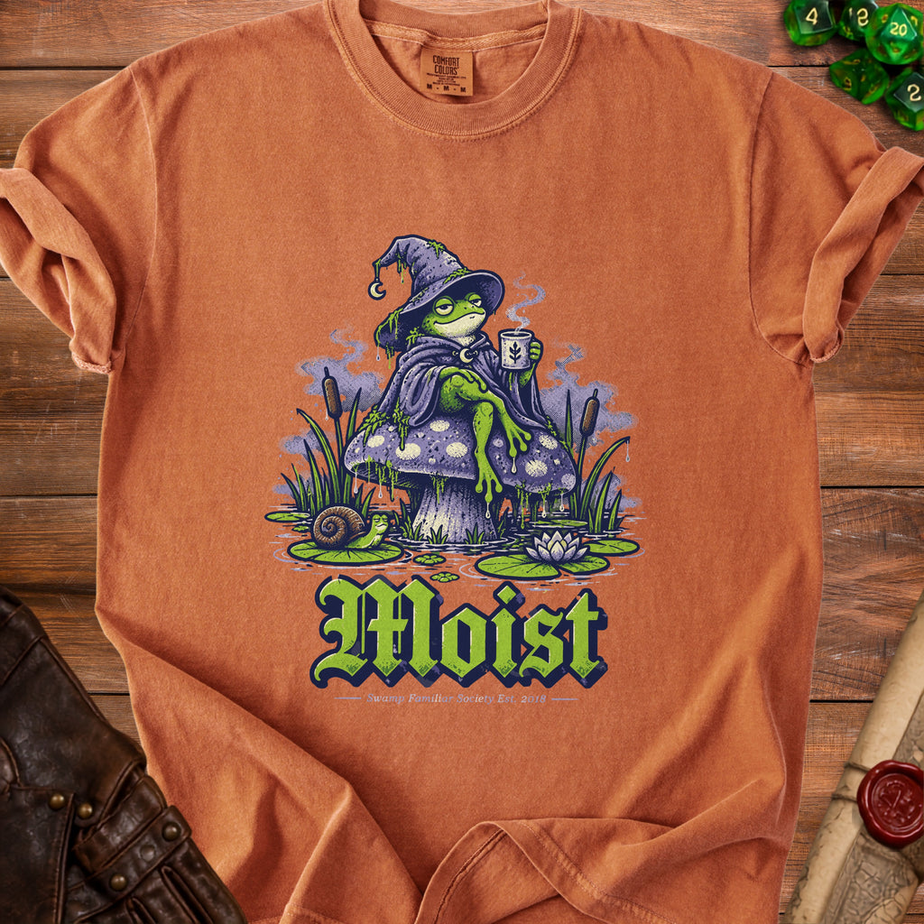 T-shirt with a wizard frog on a mushroom, text reads "Moist".