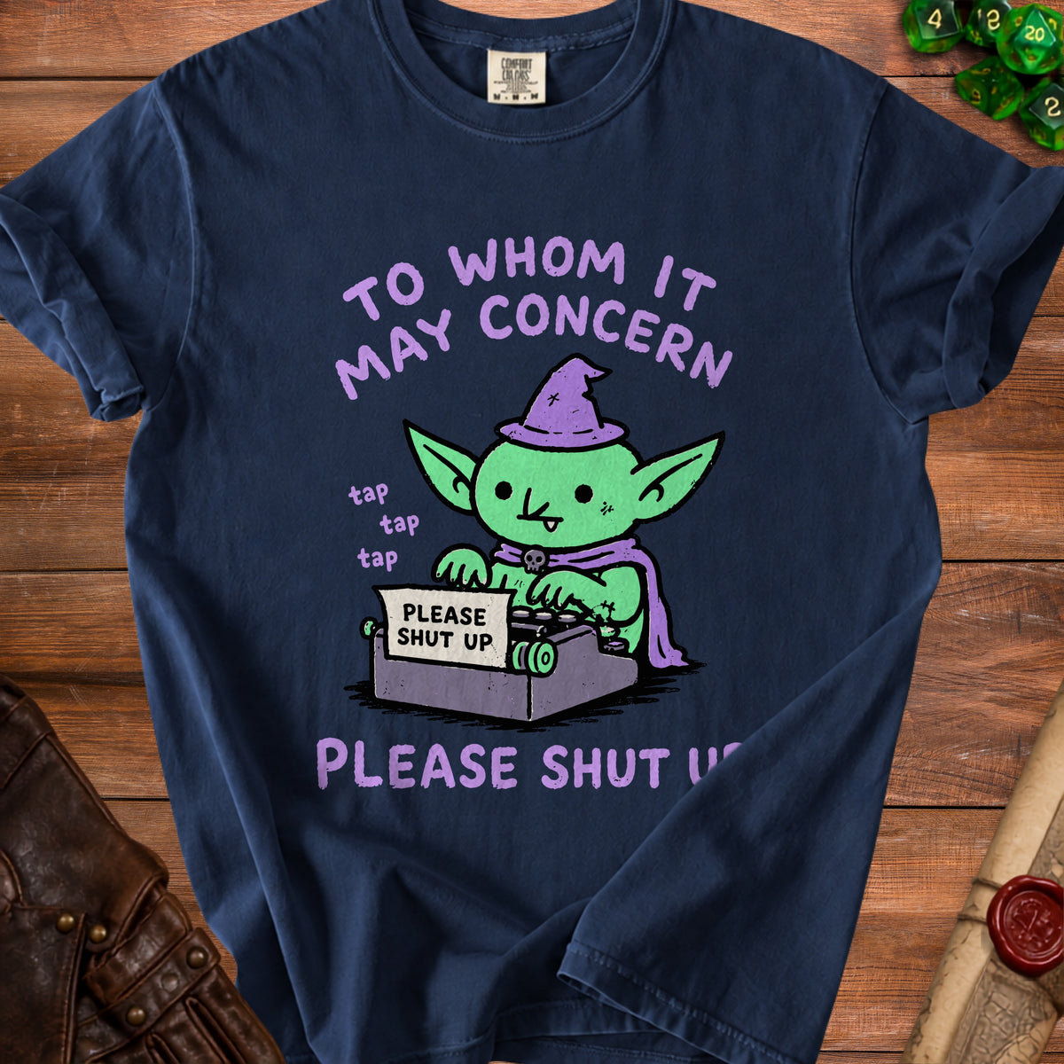 Navy t-shirt with a goblin typing "Please Shut Up" on a typewriter.