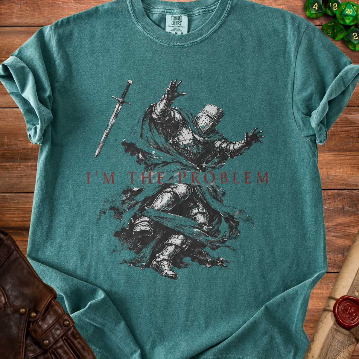 Green t-shirt with a knight graphic and text "I'M THE PROBLEM".
