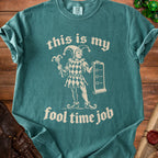 Teal t-shirt with jester graphic and text "this is my fool time job".