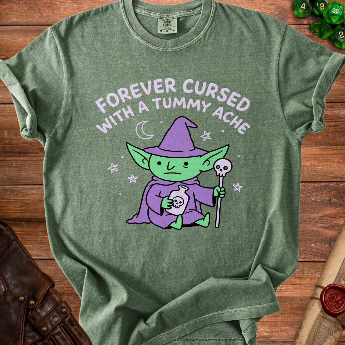 Green t-shirt with a green goblin in a purple hat holding a potion and staff.