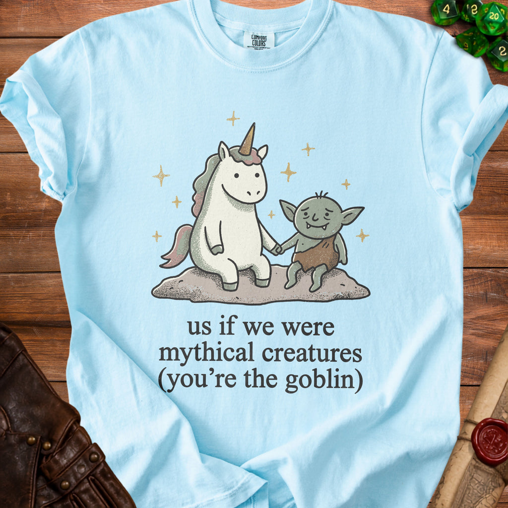 Light blue t-shirt with unicorn and goblin graphic and text: "us if we were mythical creatures (you're the goblin)".