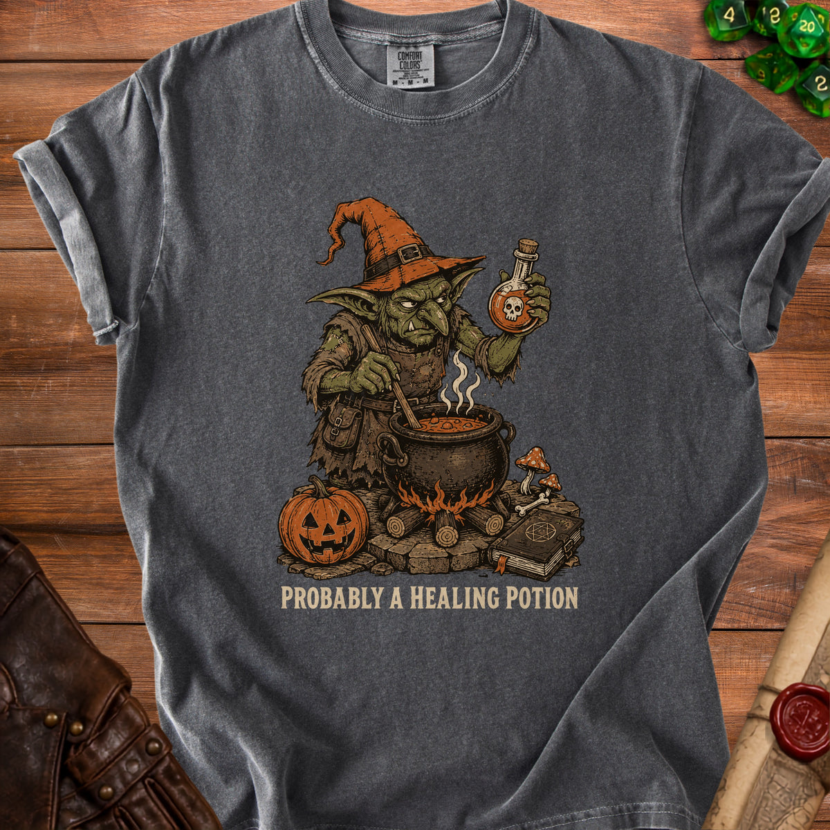 Dark grey t-shirt with a goblin brewing a potion, text reads "Probably A Healing Potion".