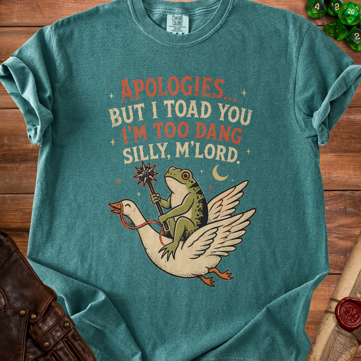 Green t-shirt with frog riding goose and text "Apologies but I toad you I'm too dang silly, m'lord."