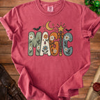 Red t-shirt with "MAGIC" text in groovy font with stars, moon, bat and wand.