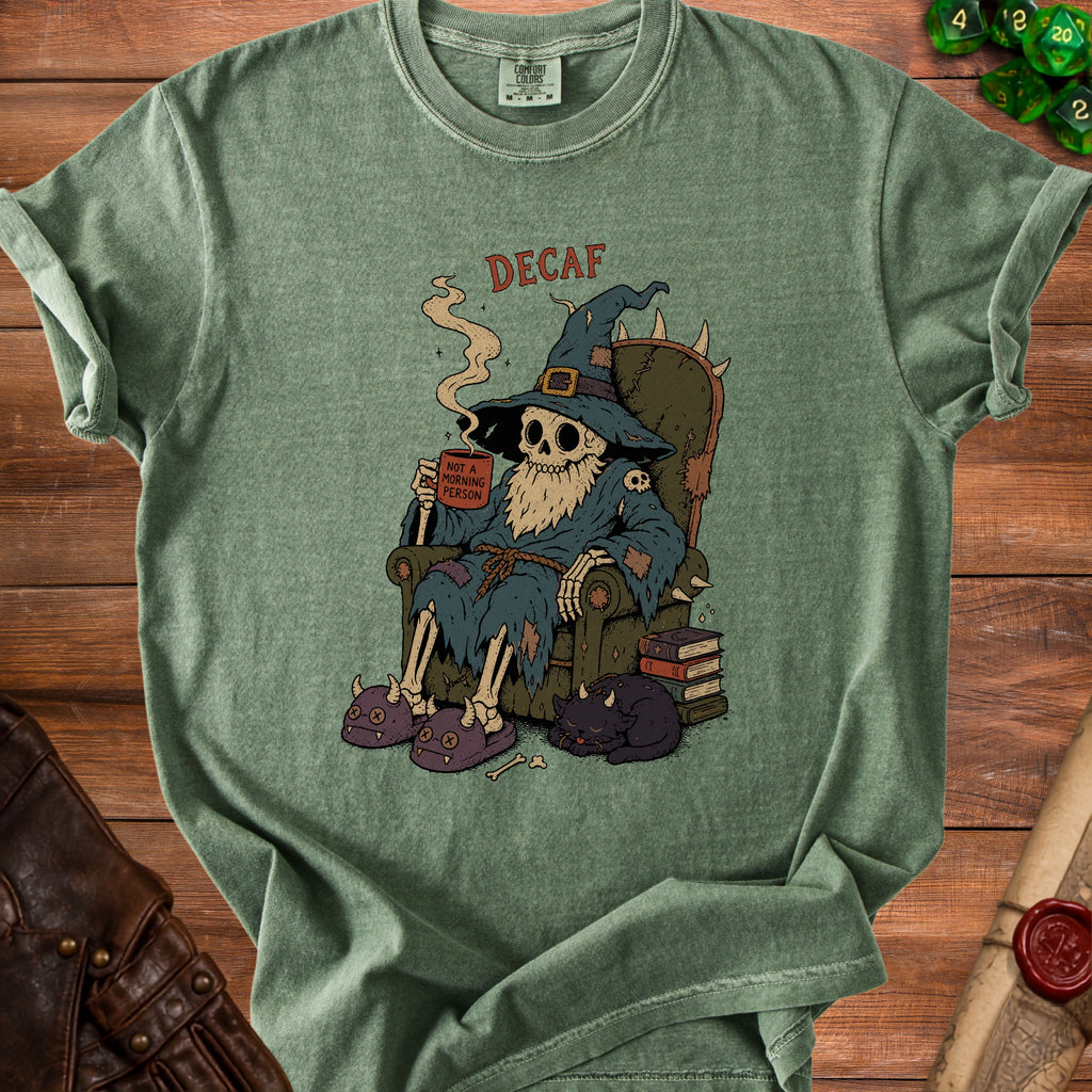 Skeleton wizard in a chair drinks from a mug labeled "Not A Morning Person."