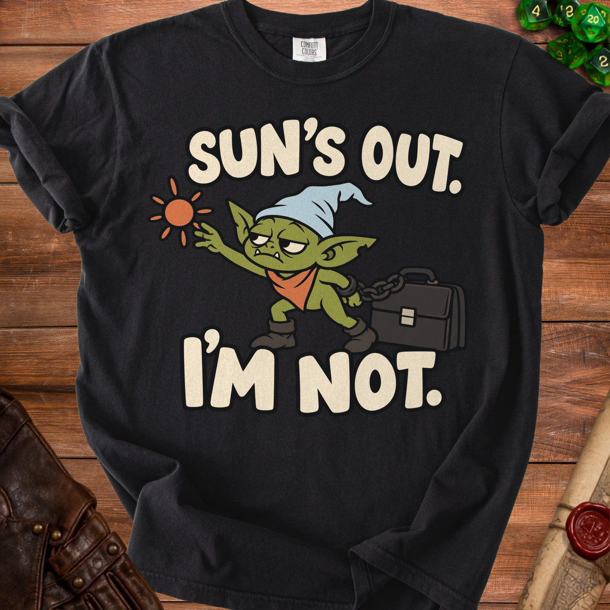 Black t-shirt with cartoon goblin and text "Sun's Out. I'm Not."