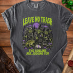 T-shirt with goblins, frog, pumpkin, and text "LEAVE NO TRASH THE GOBLINS ARE JUDGING YOU".