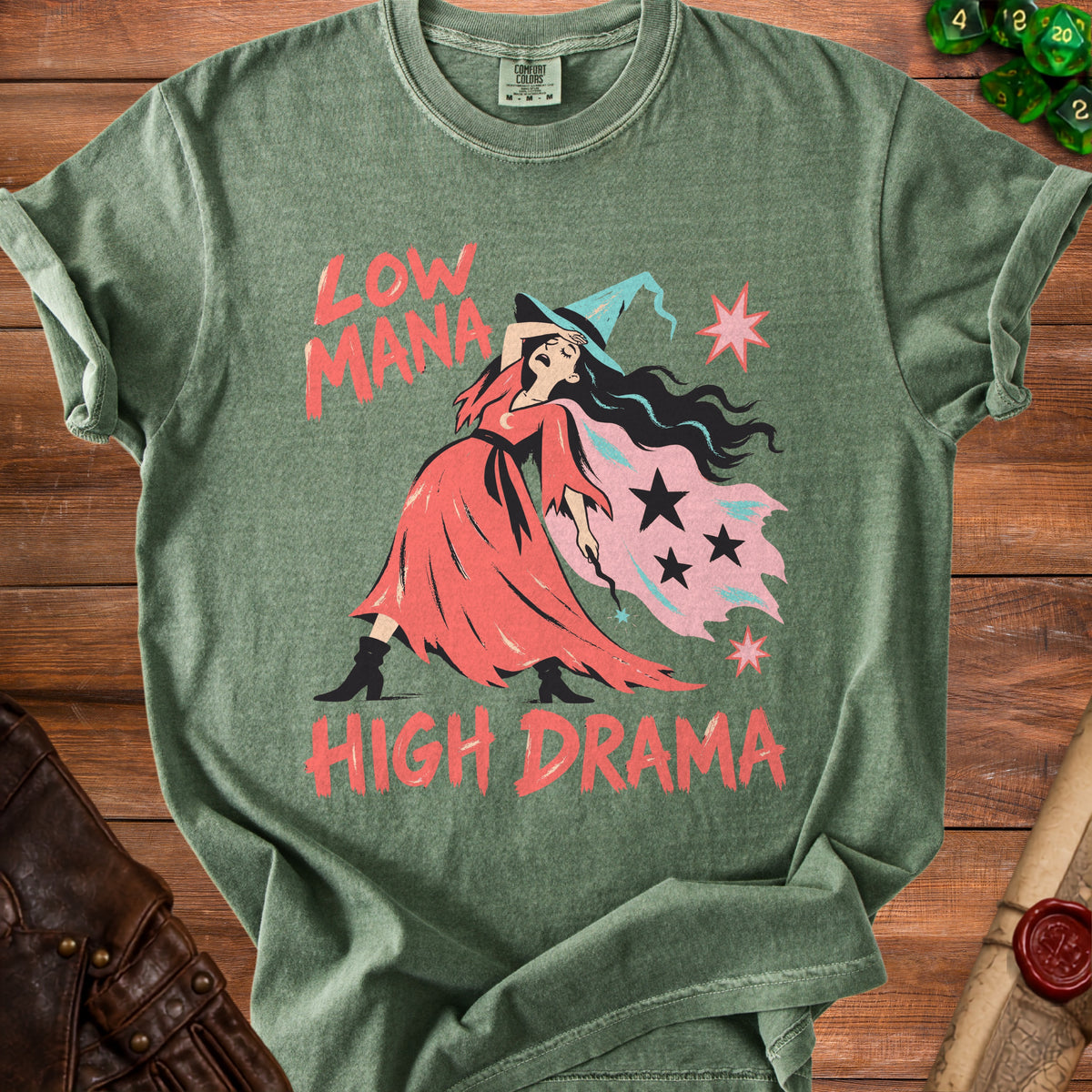 Green t-shirt with "Low Mana High Drama" text and a witch illustration.