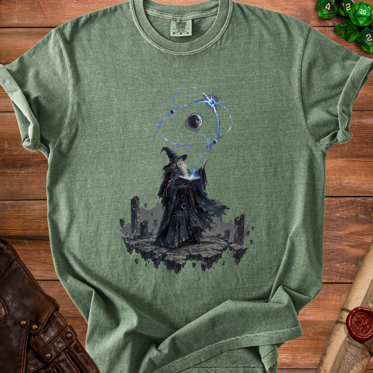 Green t-shirt with wizard casting spell with planets on floating islands graphic.