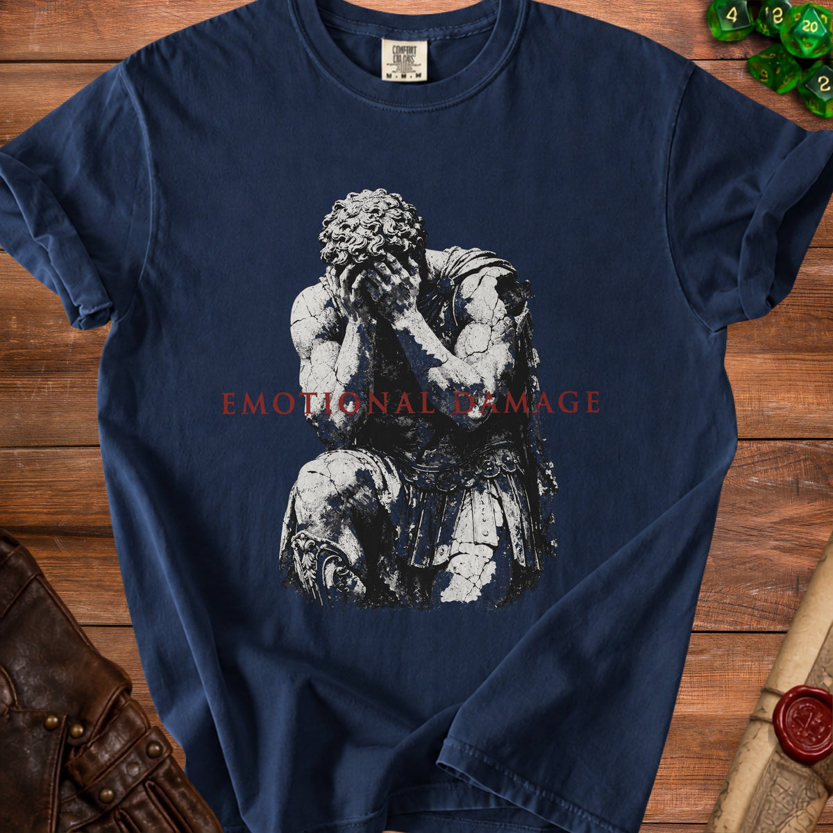 Navy t-shirt with a cracked stone statue graphic and "EMOTIONAL DAMAGE" text.