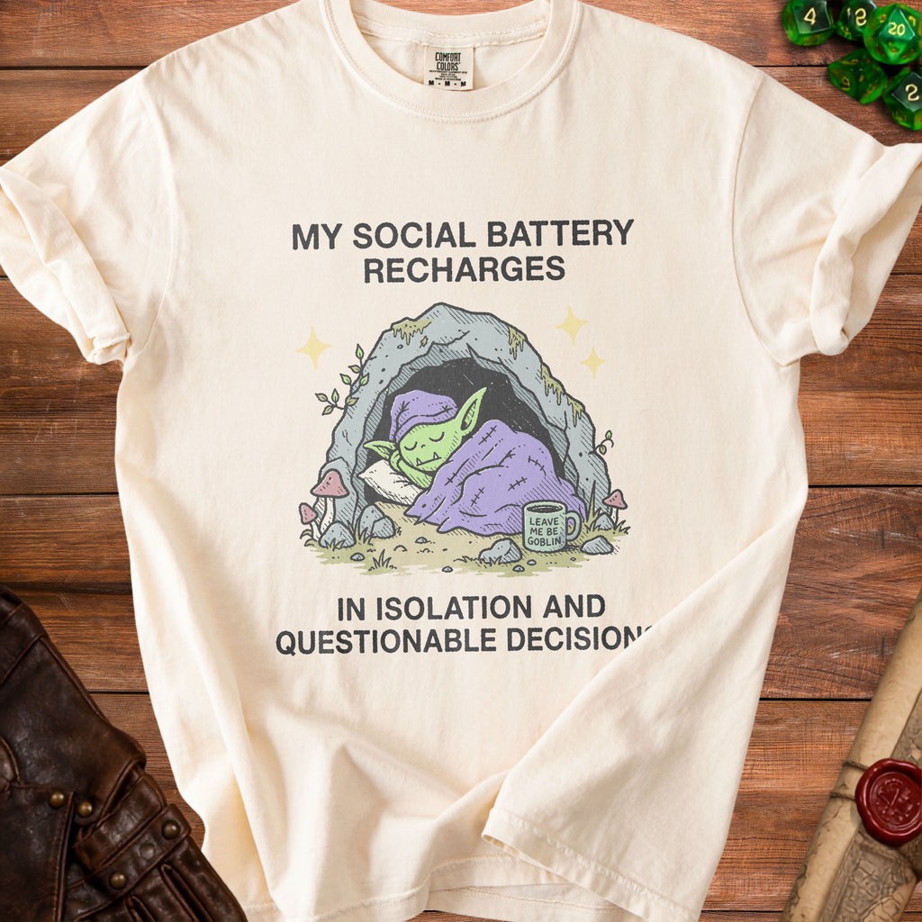 Cream t-shirt with a cartoon goblin sleeping in a cave and text about recharging.